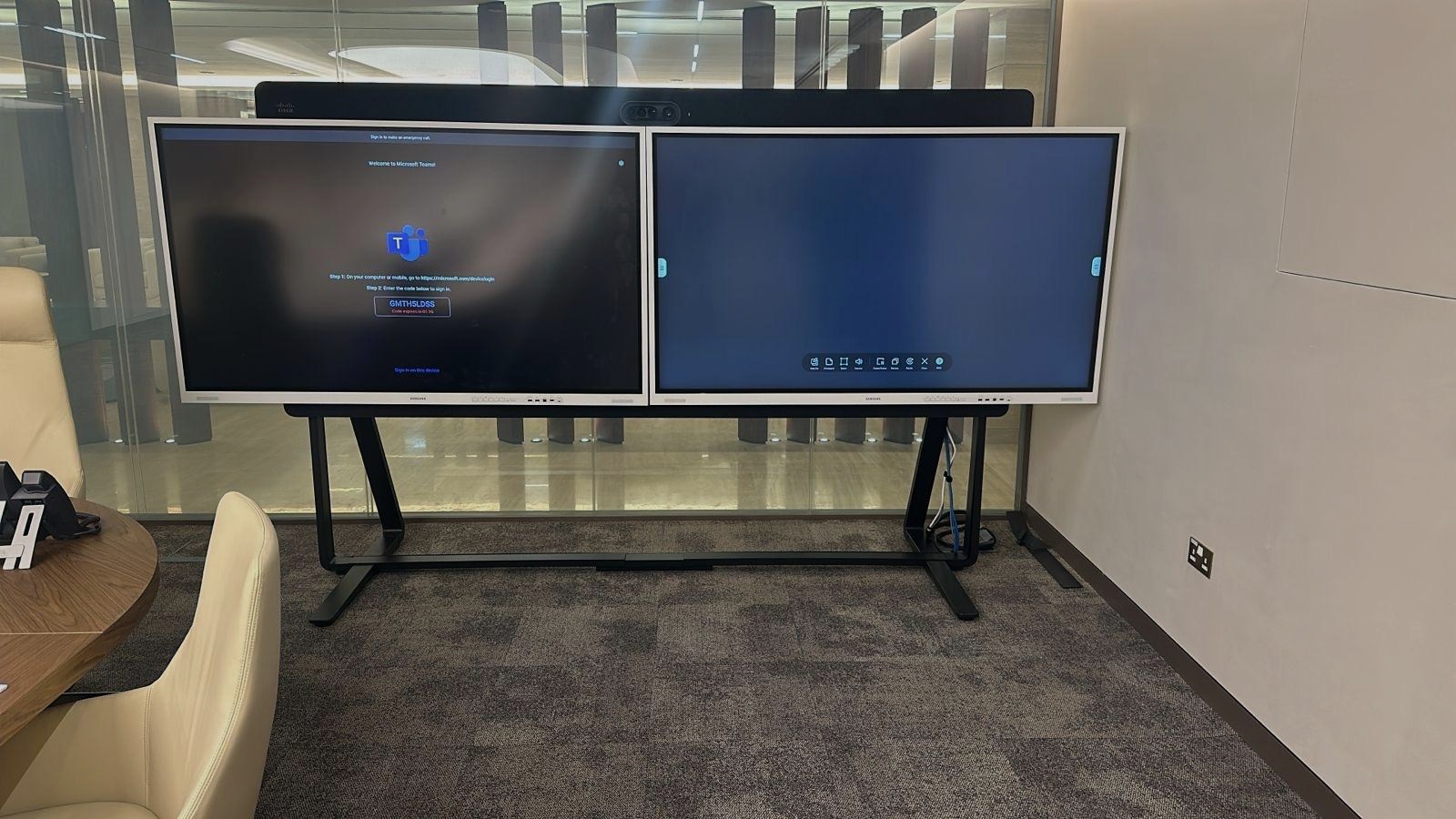 Executive boardroom with dual interactive displays at the Qatar Planning Council